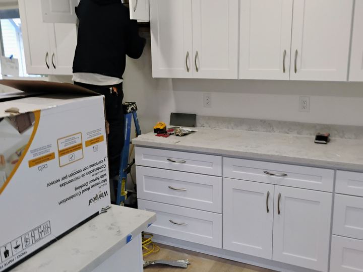 White kitchen cabinet installation